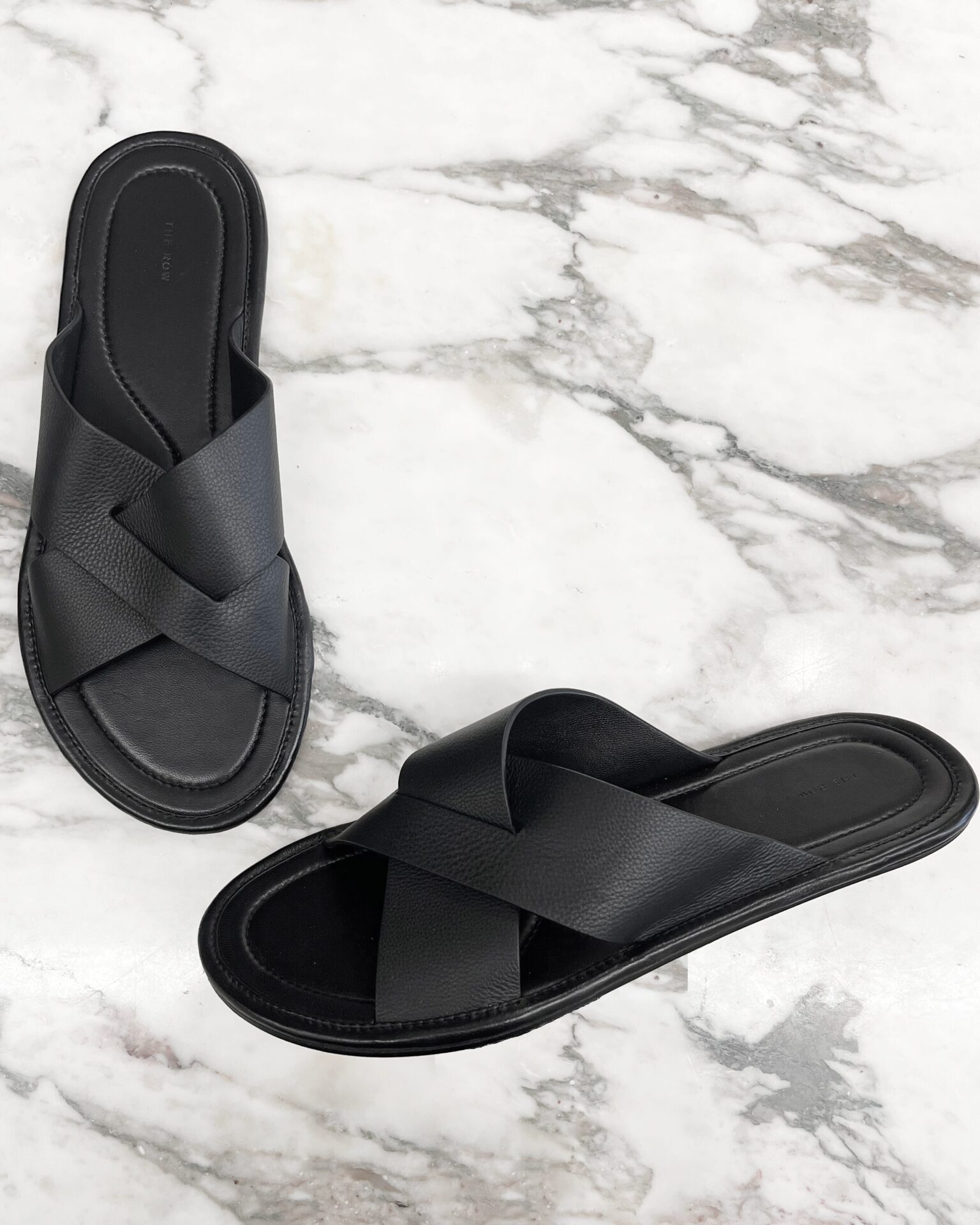 The Row Malick cross black leather sandals
