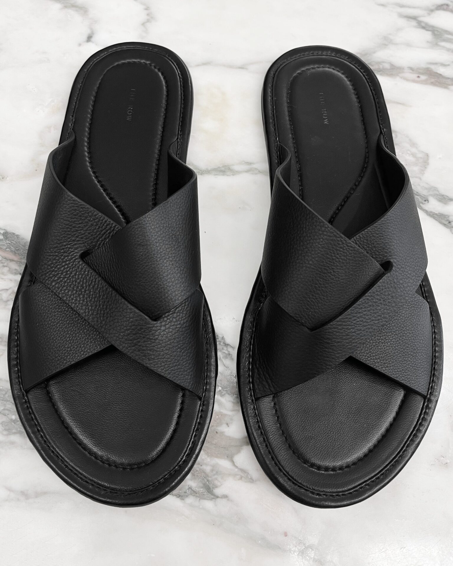 The Row Malick cross black leather sandals