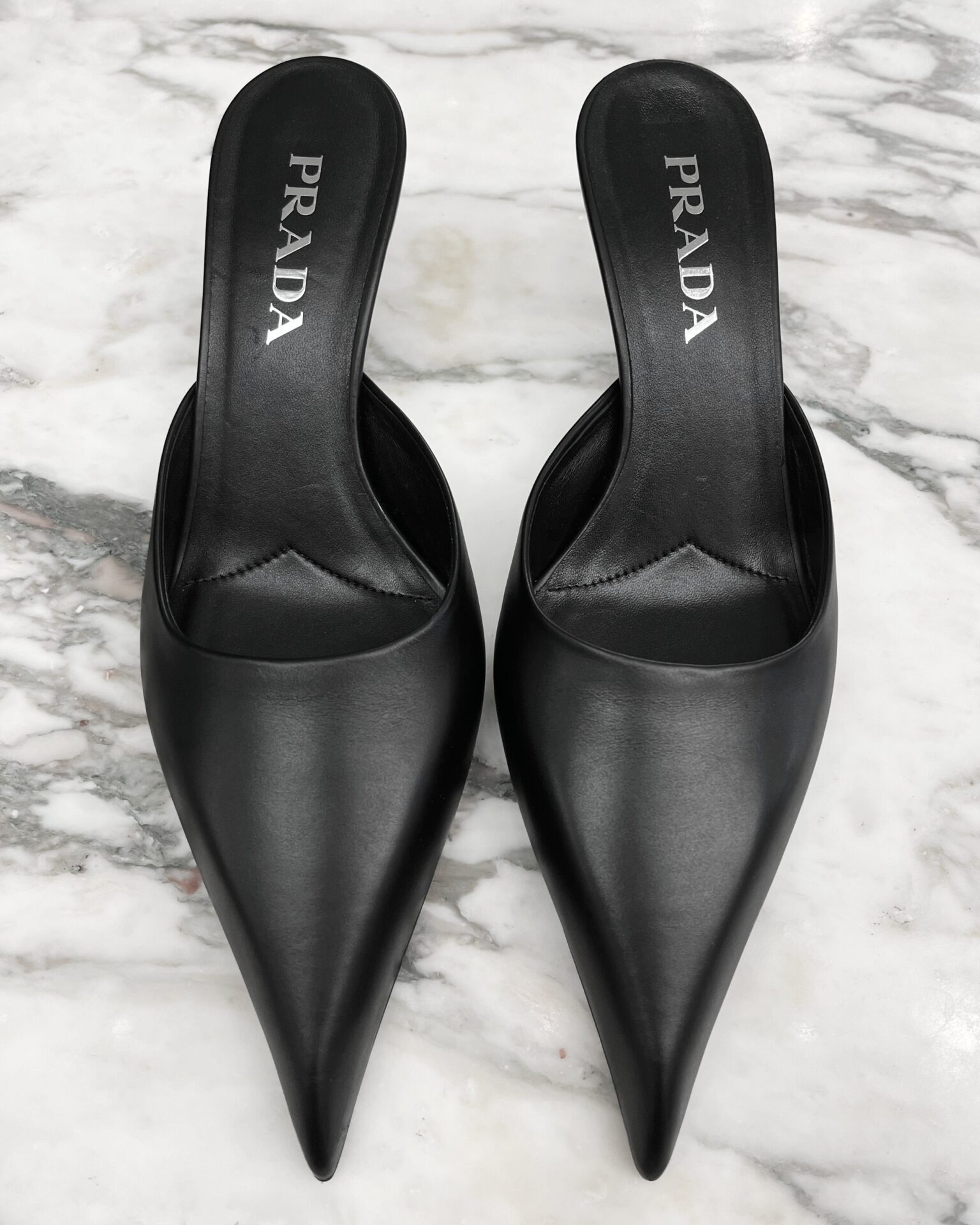 Prada black leather pointed toe kitten heel mules
