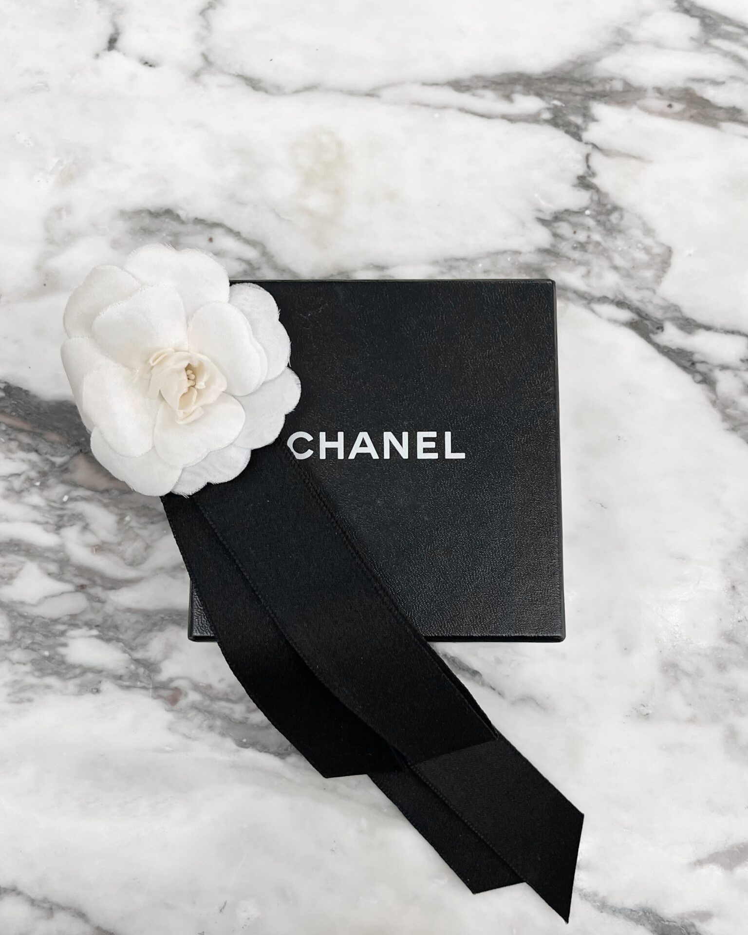 Chanel 1990's white silk Camellia brooch with silk ribbon