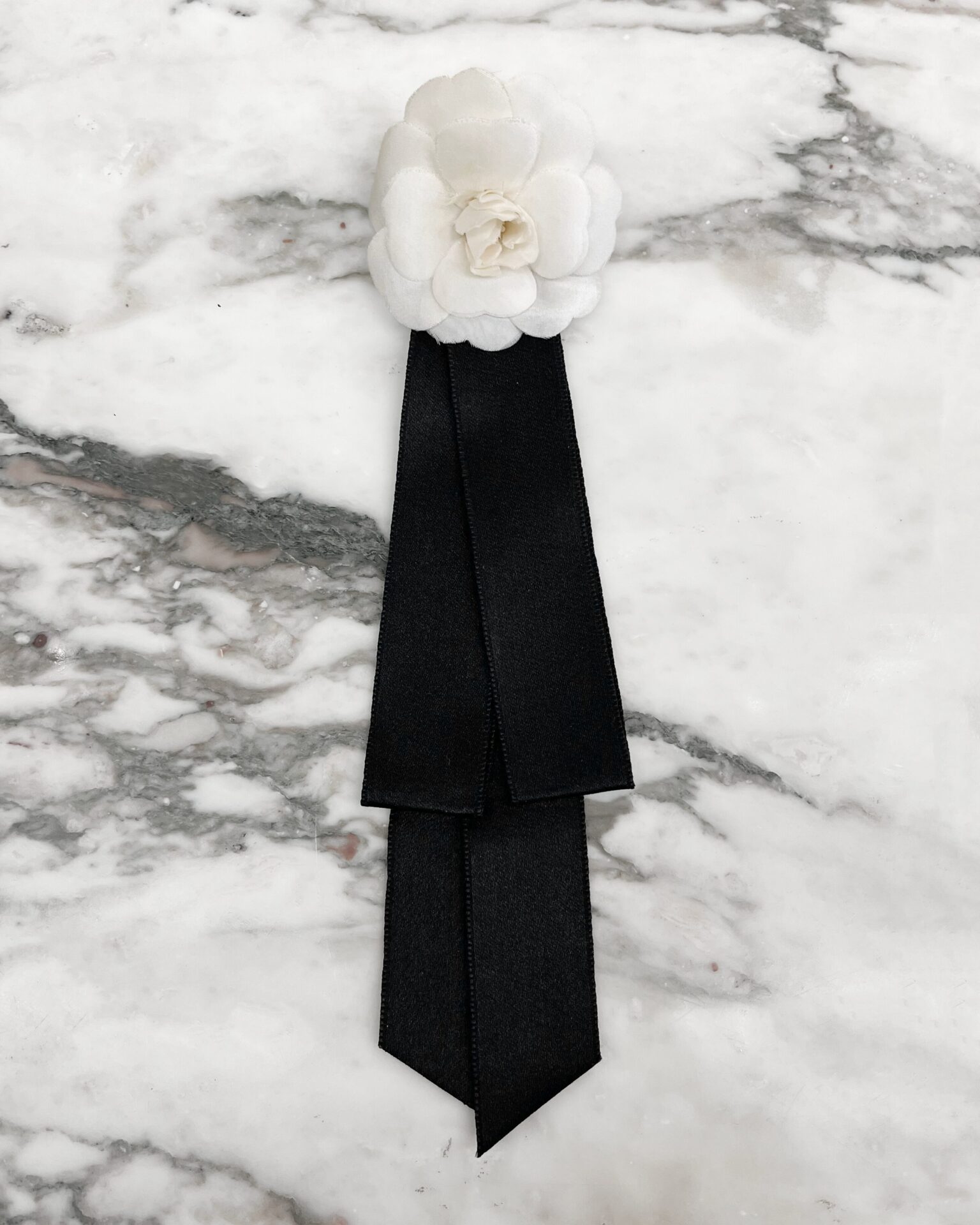 Chanel 1990's white silk Camellia brooch with silk ribbon