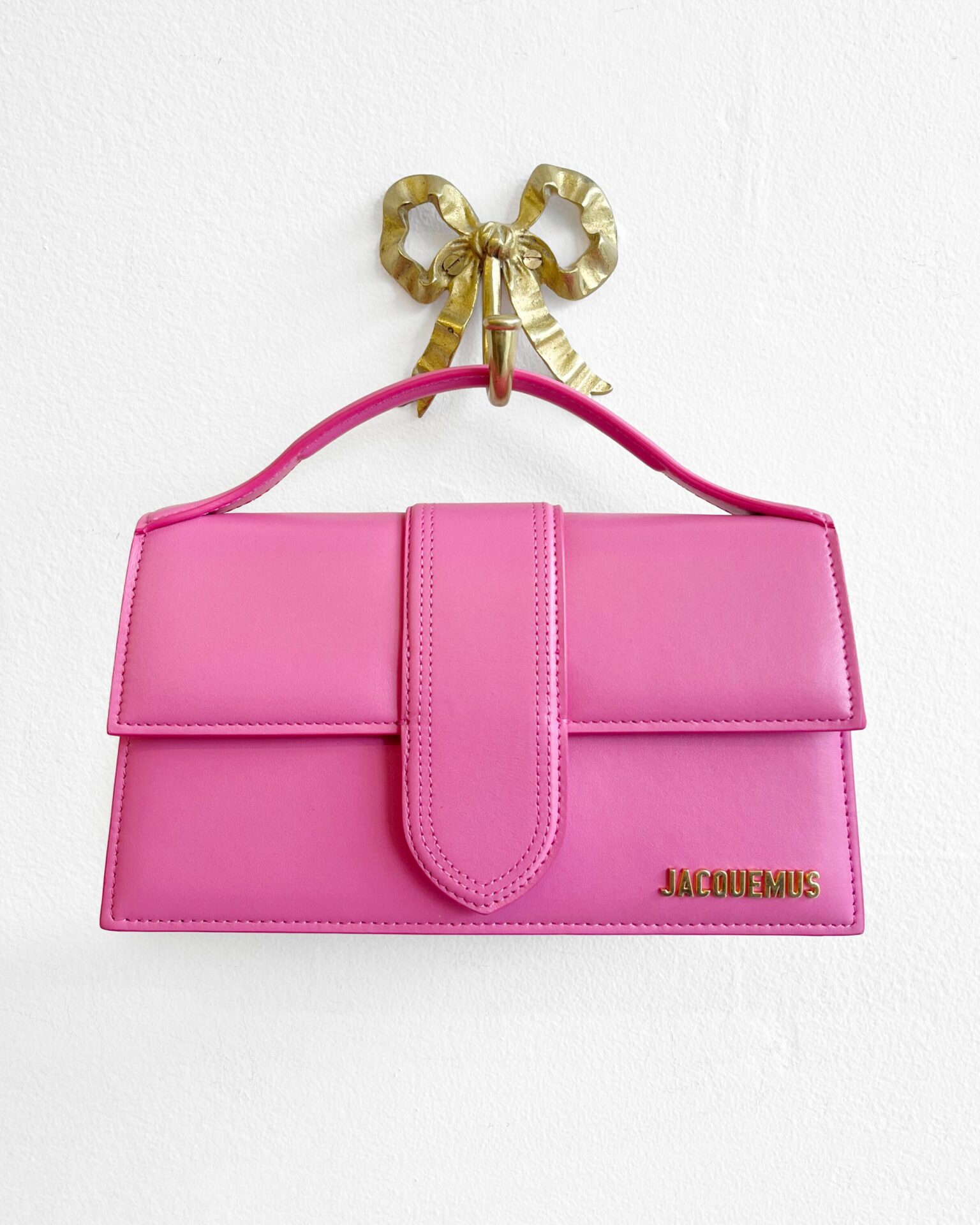 Jacquemus Le Grand Bambino purse in neon pink leather