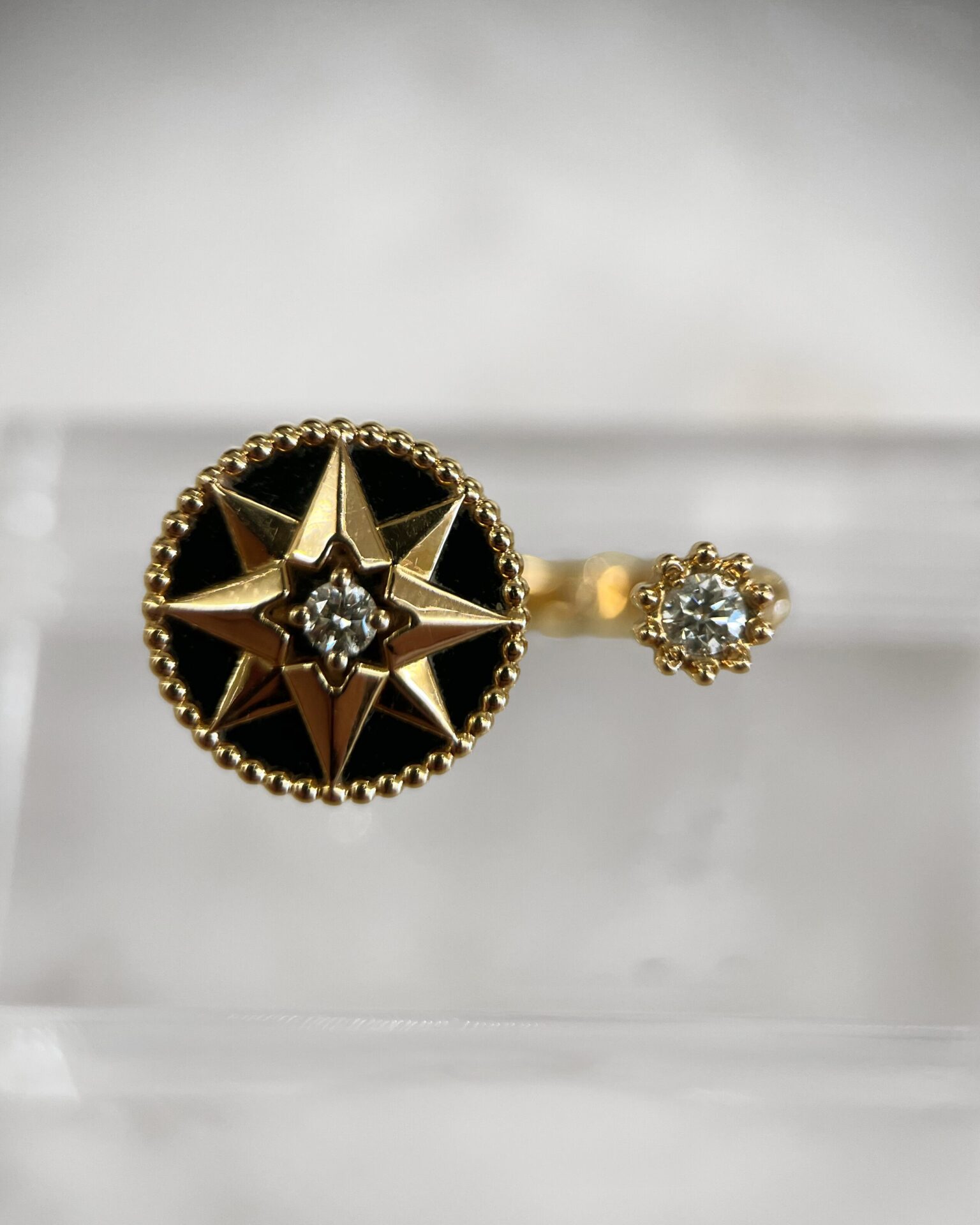 Dior 18K gold Rose des Vents ring with diamond & onyx