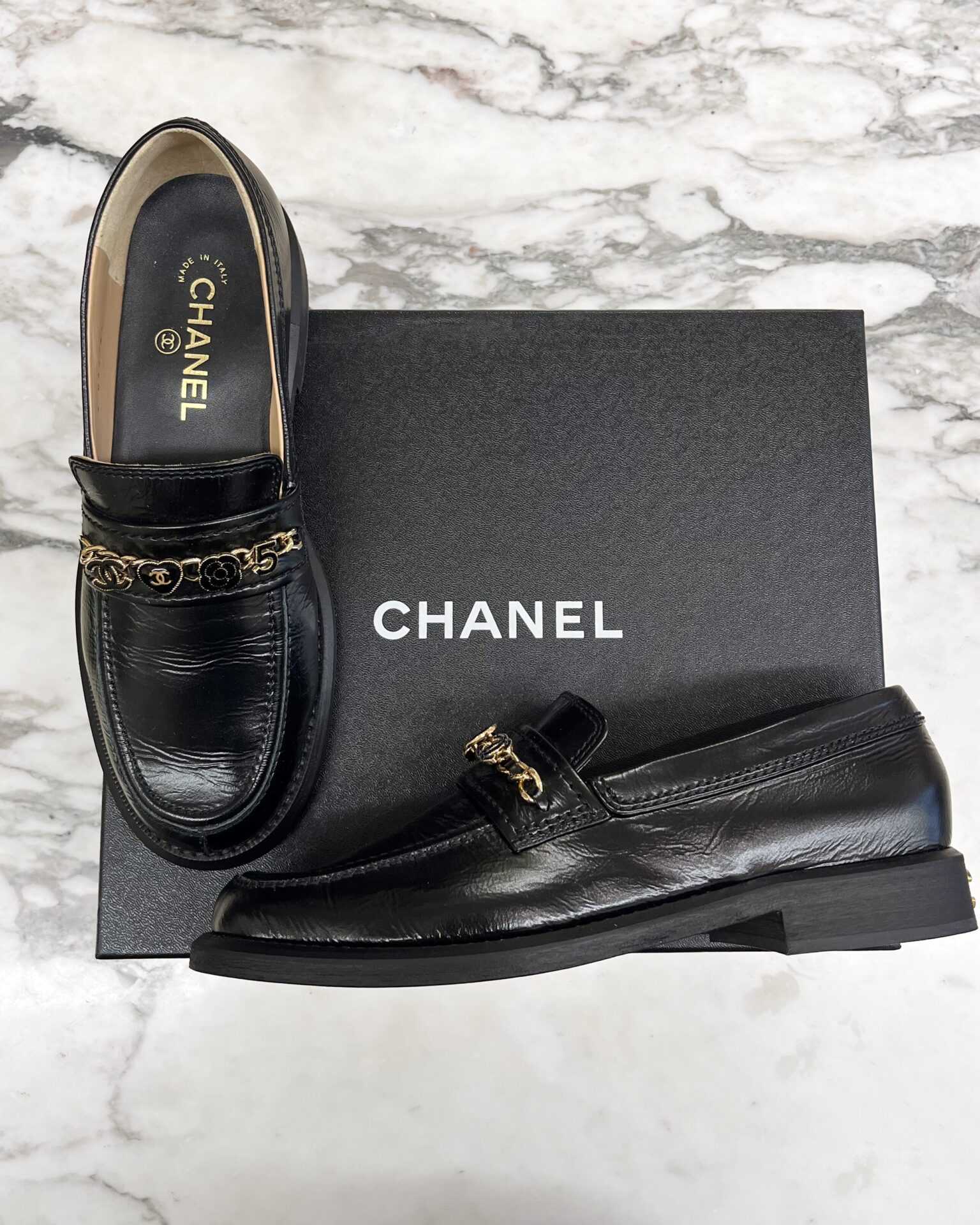 Chanel black calfskin loafers with chains